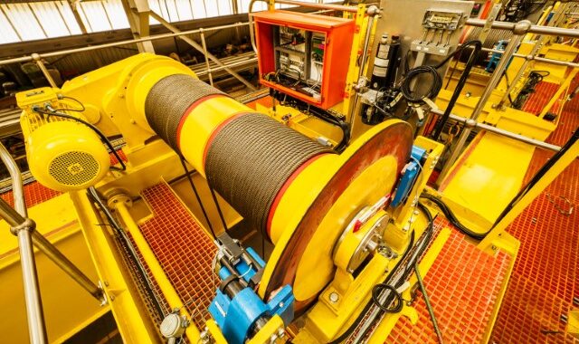 Factory Shot Of The Main Hoist On The 12,5/25/12,5 Ton Overhead Travelling Crane. Note Stainless Steel Handrails And Fiberglass Grating.